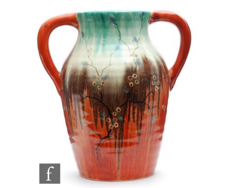A Clarice Cliff 10 inch twin handled Lotus jug circa 1934, hand painted in the May Blossom pattern with flowering blossom bou
