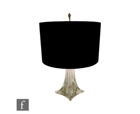 A St Louis glass table lamp on a spreading square form base rising to a tapered clear glass stem, with twin light fitting and