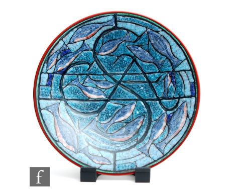 A later 20th Century Poole Studio charger decorated by Tony Morris with stylised fish swimming amidst stylised grasses, print