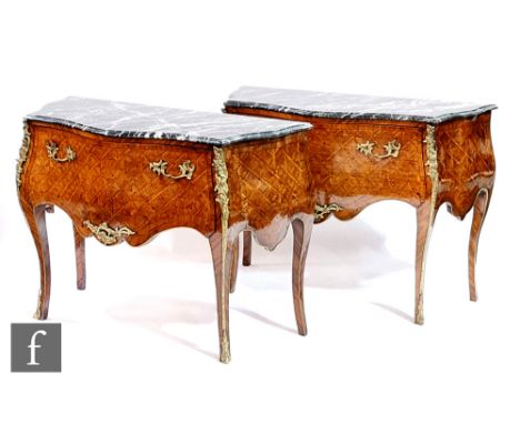 A pair of late 20th Century walnut veneered and parquetry inlaid bombe fronted commode chests in the French taste, with decor