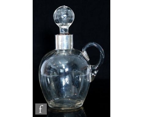 An early 20th Century Stourbridge glass and hallmarked silver spirit decanter, the ribbed ovoid body with applied handle and 