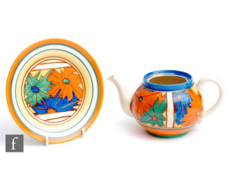 A Clarice Cliff circular side plate circa 1929, hand painted in the Umbrellas pattern with a panel of stylised star burst mot