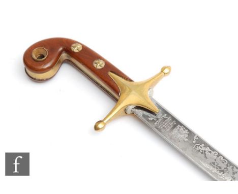 A post 1950s Marmaluke style dress sword, the 80cm curved blade named Wilkinson sword. 