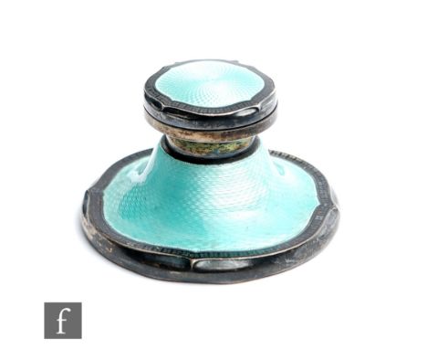 A hallmarked silver capstan ink well decorated with mint green enamel within black enamel and silver borders, diameter 8cm, B