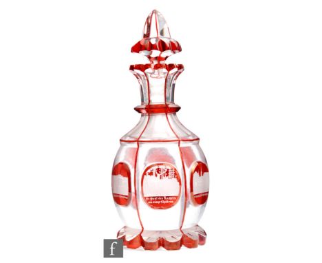 A 19th Century Bohemian Spa decanter, the petal edged foot rising to a slice cut and panel decorated swollen body beneath a k