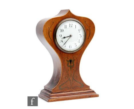 An Art Nouveau inlaid balloon shaped mantle clock, circular white enamelled dial on a stepped base, height 25cm. 