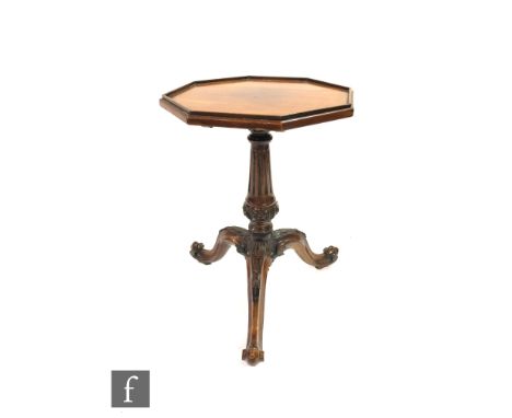 A Victorian octagonal mahogany wine table on tapering fluted pedestal and scroll tripod base, diameter 38cm. 