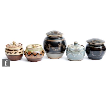Five assorted Winchcombe Pottery lidded preserve pots and trinket boxes of varying form with hand painted glaze decoration, a