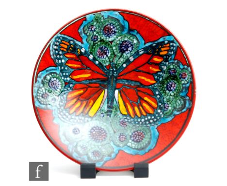 A later 20th Century Poole Pottery Studio charger designed by Tony Morris and decorated with a large central butterfly agains