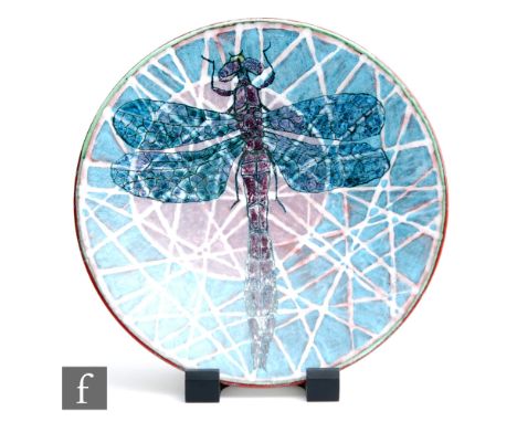 A later 20th Century Poole Pottery studio charger designed by Tony Morris and decorated with a large dragonfly against purple