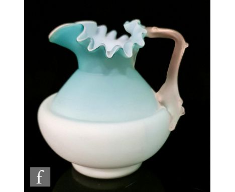 A late 19th Century footed glass jug, of shouldered form decorated in a satin finished turquoise over opal, with applied sati