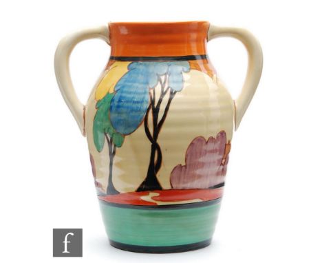 A Clarice Cliff 10 inch twin handled Lotus jug circa 1930, hand painted in the Blue Autumn pattern with a stylised tree and c