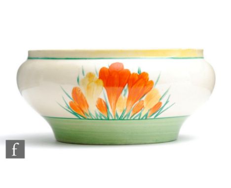 A Clarice Cliff Ivor shape bowl circa 1930, hand painted in the Sungleam Crocus, hand painted with crocus sprays in orange an