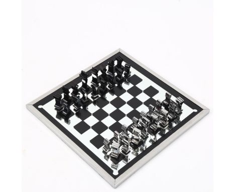 A 1960s' modernist chess set by ALCAN, France, aluminium pieces with aluminium framed mirror board, 36cm sq. Good original co