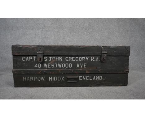 A vintage painted wood bound travelling trunk with twin carrying handles. H.36 W.100 D.48cm 