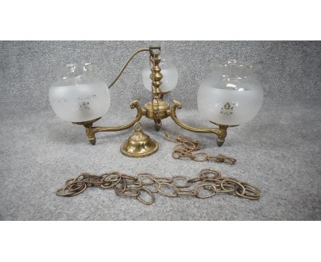 A vintage three branch scrolling design brass chandelier with frosted glass etched floral design globe shades. H.76 W. 42 D.4