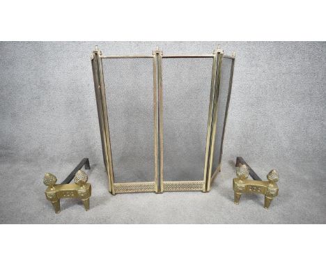 A pair of Victorian acanthus design solid brass fire dogs along with a pierced design mesh brass fire screen. H.63 W.75 