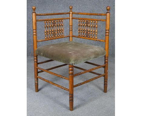 A late 19th century beech bobbin turned corner chair. H.68cm 