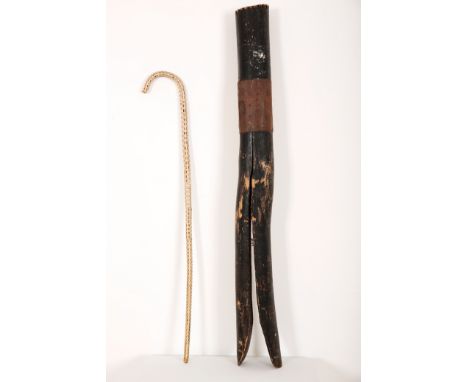 A FOLK ART GIANT CLOTHES PEG AND A SHARK VERTEBRAE WALKING CANE19th century and later, the first realistically carved from wo