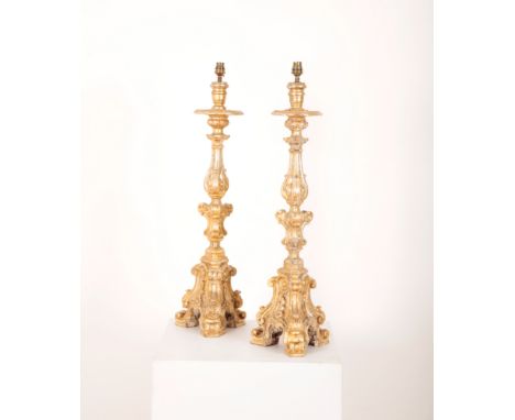 A PAIR OF GILTWOOD TABLE LAMPSmodern, on tripod bases, 80cm high (2)