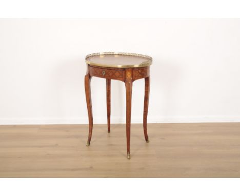 A LOUIS XV STYLE EXOTIC WOOD AND MARQUETRY INLAID OVAL TABLE OR DESKprobably 19th century, with later tooled leather top surr