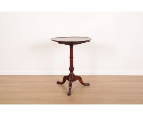 A GEORGE III MAHOGANY CIRCULAR WINE TABLEthe tilt top with moulded edge, on ring turned column and cabriole legs, 63cm high x