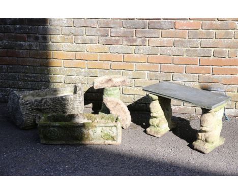 TWO RECONSTITUTED STONE GARDEN TROUGHSone with flower bosses and the other shaped as a log, the larger of the two 35cm high x