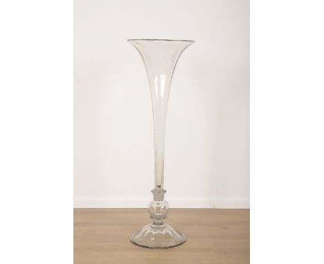 A VICTORIAN CLEAR FLUTED GLASS OVERSIZE TRUMPET VASE19th century, terminating on a circular spread foot base, 98cm high x 28c