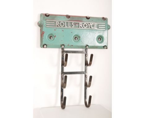 A ROLLS ROYCE ENGINE ROCKER COVER CONVERTED TO COAT HANGERfitted with later ladder of six hooks, stamped to the reverse 'CV21