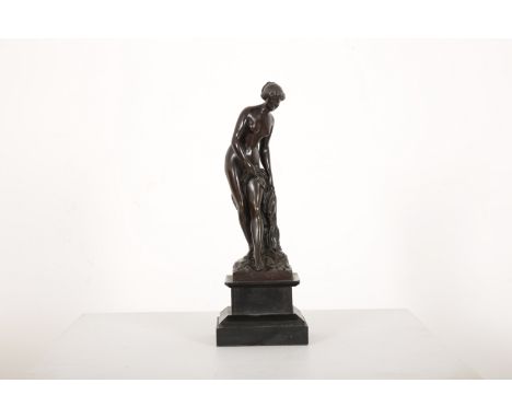 A BRONZE FIGURE OF 'BAGNEUSE' AFTER ETIENNE MAURICE FALCONET (1716-1791)the patinated bronze on a stepped socle base, 33cm hi
