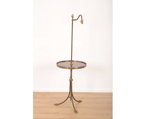 AN EDWARDIAN MAHOGANY AND BRASS STANDARD LAMP TABLEearly 20th century, the circular wood table with pierced brass gallery, th