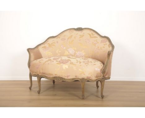 A FRENCH DEMI-LUNE ROCOCO STYLE FRENCH SOFA20th century, terminating with four French whorl feet to the back and two to the r