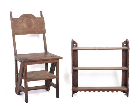 An Edwardian oak four tread folding library step chair, the broad horizontal splat with roundel ornament, 87cm height, 43cm w