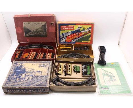 Three minor manufacturer’s clockwork train sets and a Bing loco &amp; tender, all 0-gauge: Brimtoy red ‘Royal Scot’ loco &amp