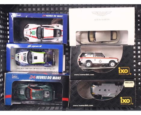 Six Spark, IXO, and Minichamps 1:43 scale modern issue diecast models to include an Aston Martin V8 automatic, rear wing deta
