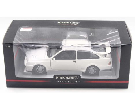 Minichamps 1/18 scale modern issue diecast model of a Ford Sierra RS 1988 in white body, housed in a plastic window display c
