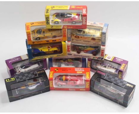 11 1:43 scale Onyx Model cars to include a Jaguar XJR-9, a Haas F1 car, a Williams F1 car, a Porsche 962-C, and others, all h