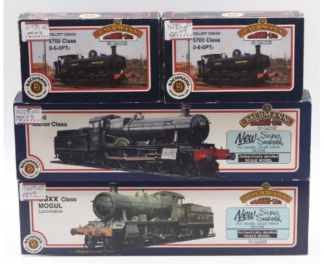Four Bachmann 00 gauge locos to include a 57xx Pannier tank, in GWR green, 7754, a 57xx in GWR green, No.7760, a 93xx Mogul i