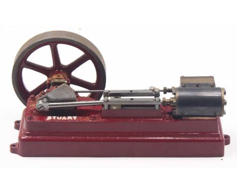 A Stuart Turner horizontal stationary steam engine comprising of a single cylinder with slip eccentric powering a heavy spoke