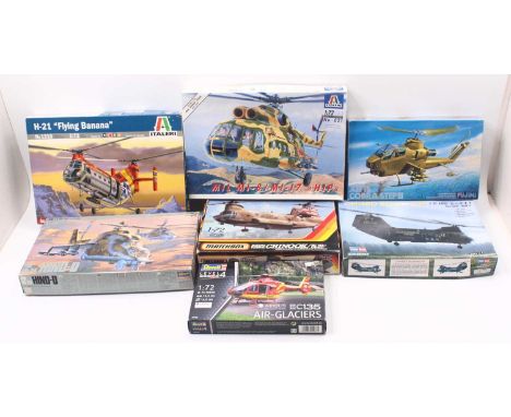 Seven 1:72 scale Revell or similar plastic helicopter kits, to include an EC135 rescue helicopter, an AH-1S cobra attack heli