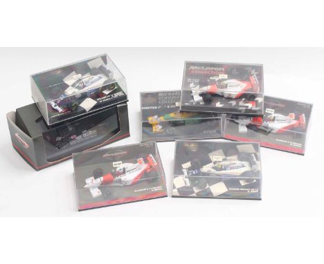 Seven Minichamps 1:43 scale cars, including three McLaren F1 cars, two Williams F1 cars, a Benetton Ford F1 car, and a McLare
