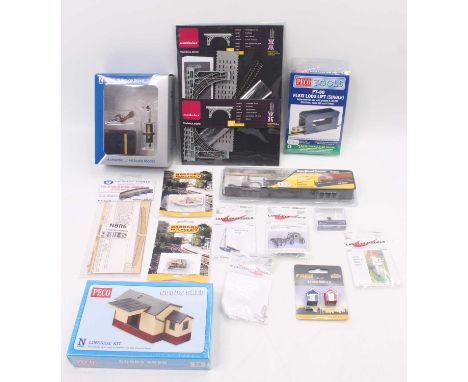 One box of N gauge accessories and electronics to include a 6-pin DCC decoder, a Lazer cut kit for iron bridge, by Modlelux, 