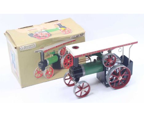Mamod TE1A traction engine, of the usual specification, comprising a green boiler, red wheels, sliver firebox, and a black bu