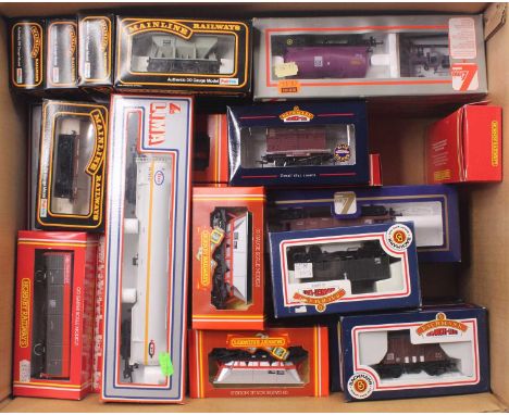 A mixed collection of 00 gauge wagons to include Lima Bogie tankers, Lima PCA takers, MEA wagons by Bachmann, Hornby HAA wago