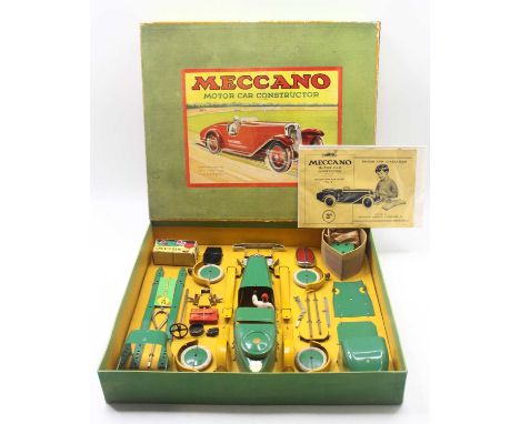 Meccano Motor Car Constructor Set No.2 with a No.2 Car Outfit Leaflet, with parts in green and yellow, re-strung on the origi