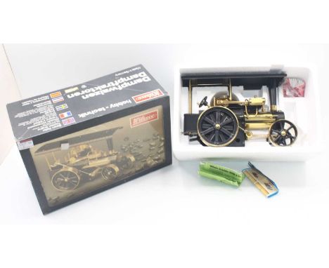 Wilesco D406 steam roller, finished in black and brass, complete with burner, appears unused, housed in the original box, wit