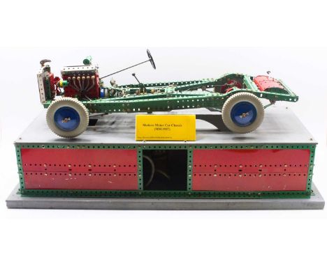 Original 1960s Meccano Dealer Display Motor Chassis, light green and red components raised on wooden base, the model base con