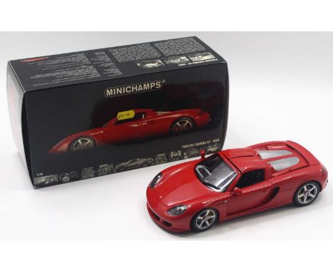 Minichamps 1/18 scale modern issue diecast model of a Porsche Carrera Gt 2004 in red body, housed in a polystyrene packed pic