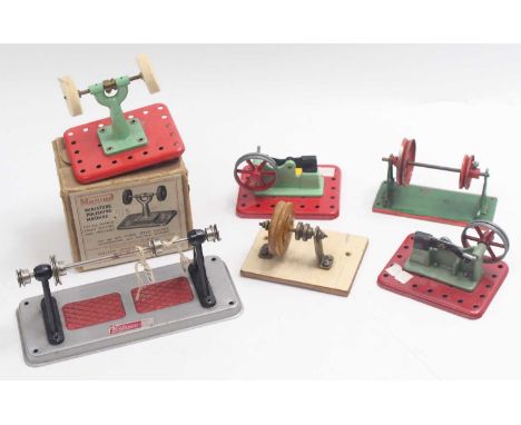 A collection of Mamod and other stationary steam engine implements, including two hammer implements, a set of unmarked pulley