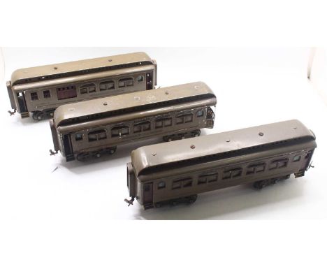 Three Lionel gauge 1 bogie coaches ‘New York Central Lines’ all with 6-wheel bogies: Light khaki colour with gold lettering. 